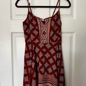 Size small, stretchy women’s red patterned dress.